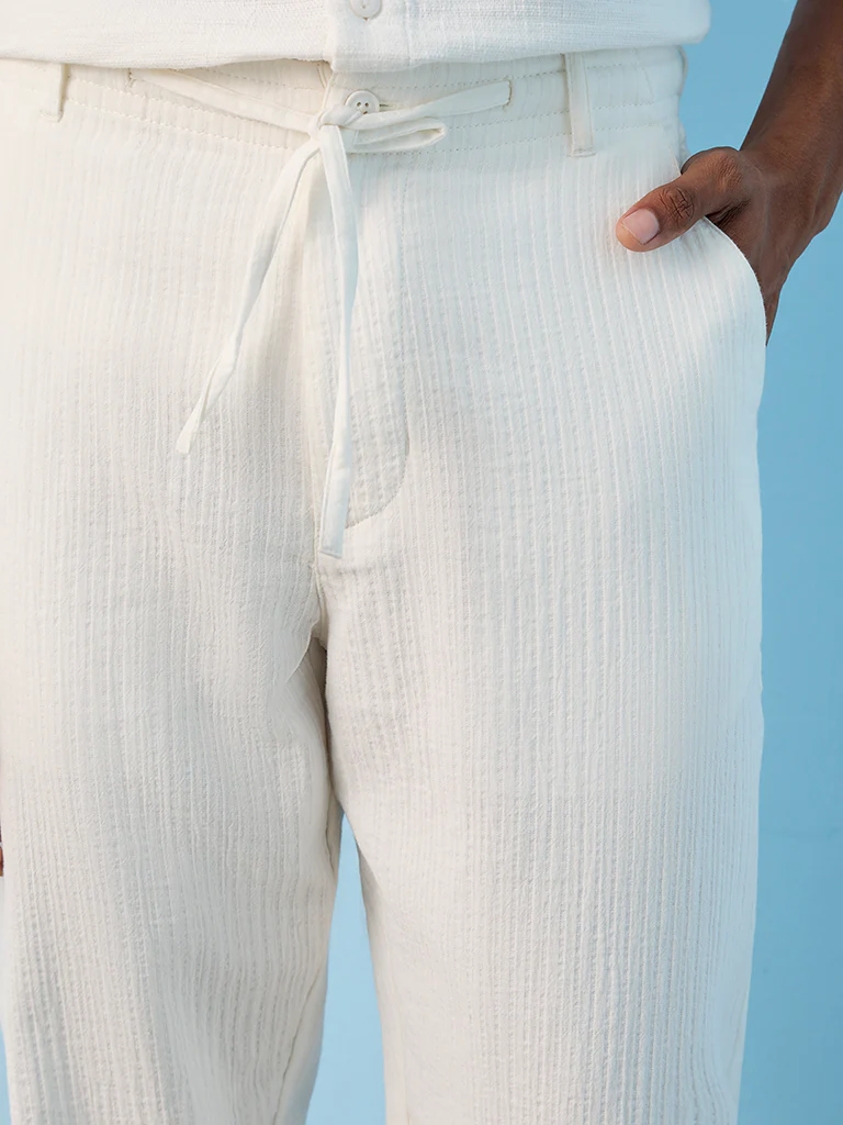 ETA Off-White Textured Relaxed-Fit Mid-Rise Cotton Pants - Image 3