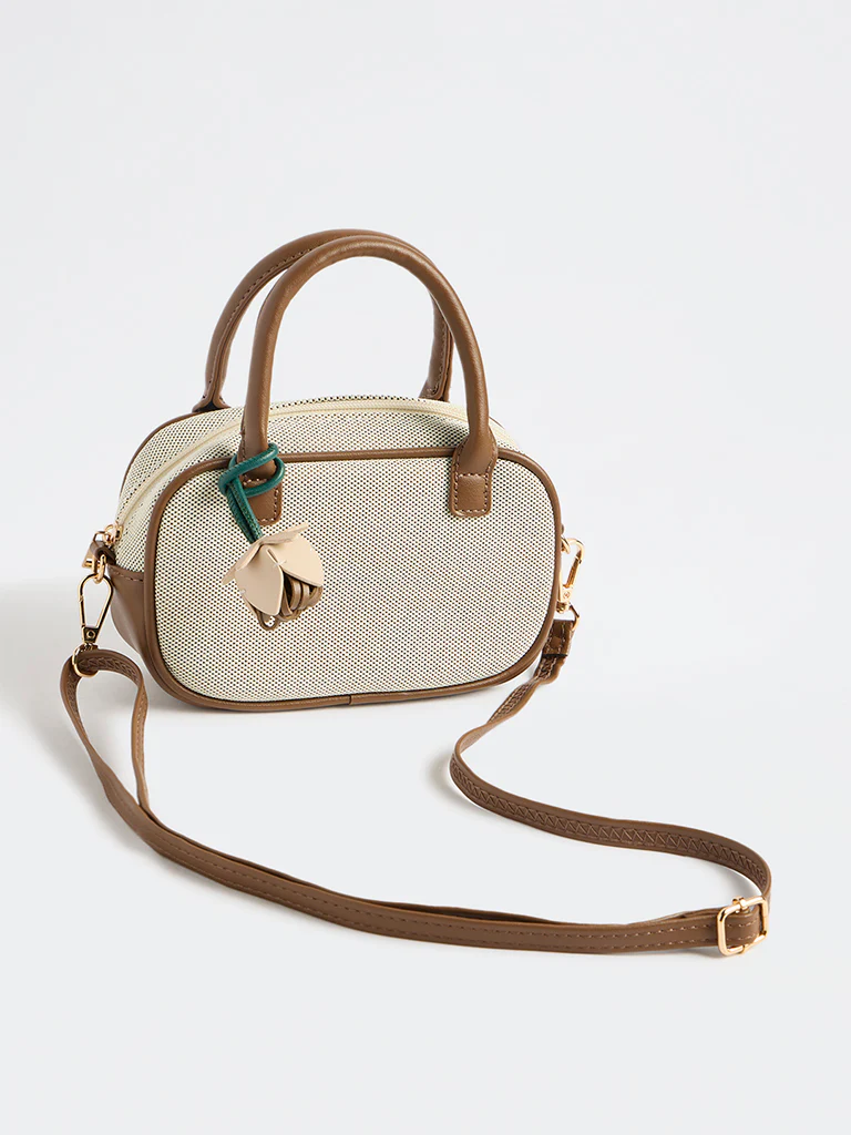 Westside Off-White Textured Sling Bag with a Floral Bag Charm - Image 2