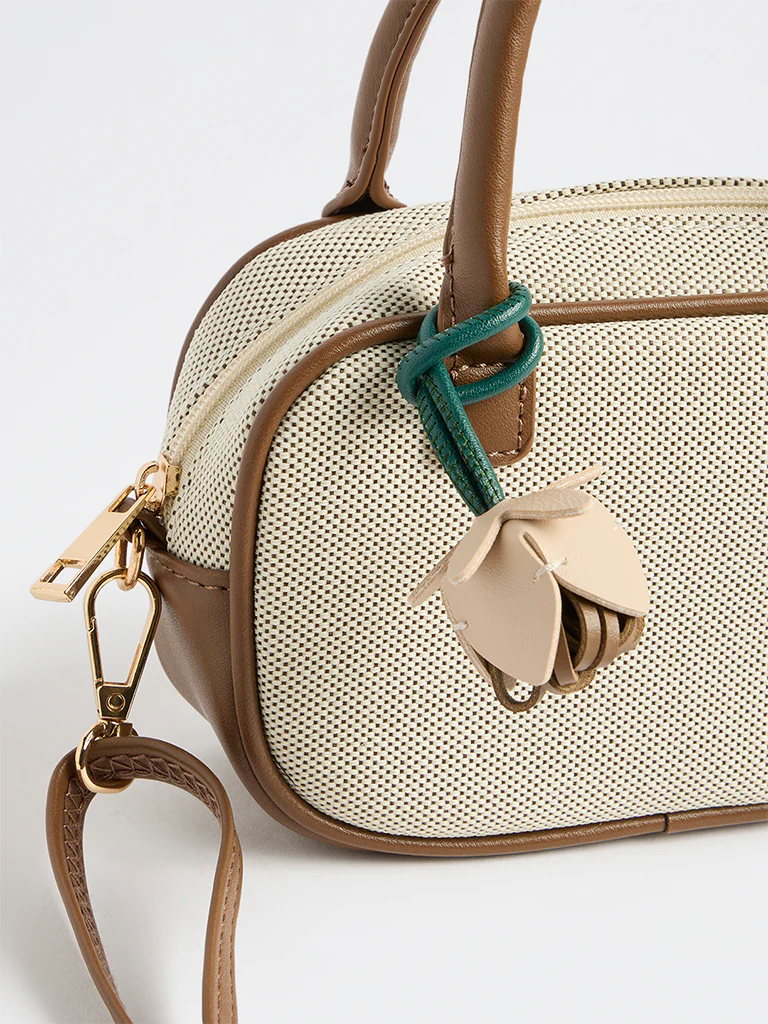 Westside Off-White Textured Sling Bag with a Floral Bag Charm - Image 3
