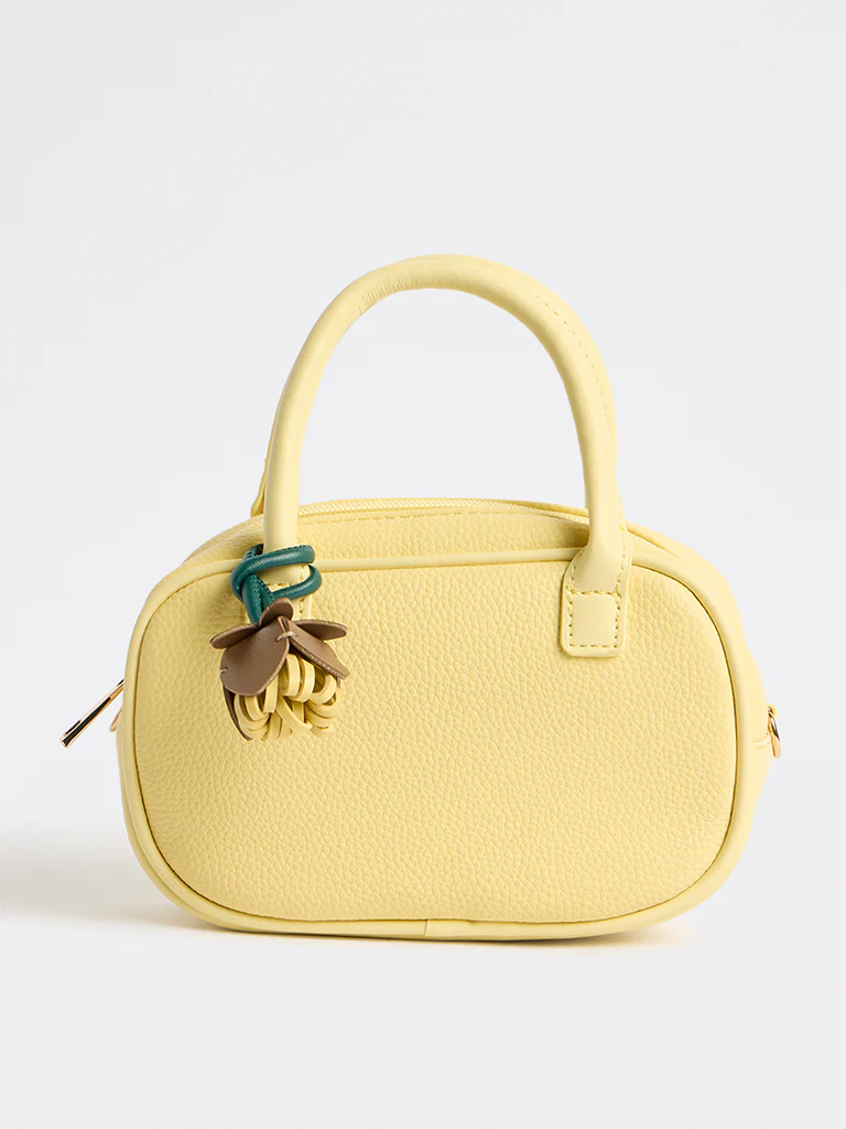 Westside Yellow Textured Sling Bag with a Floral Bag Charm